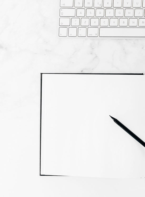 Minimalist setup with a white keyboard, tablet, and sketching pencil—perfect for digital creativity and design workflow.