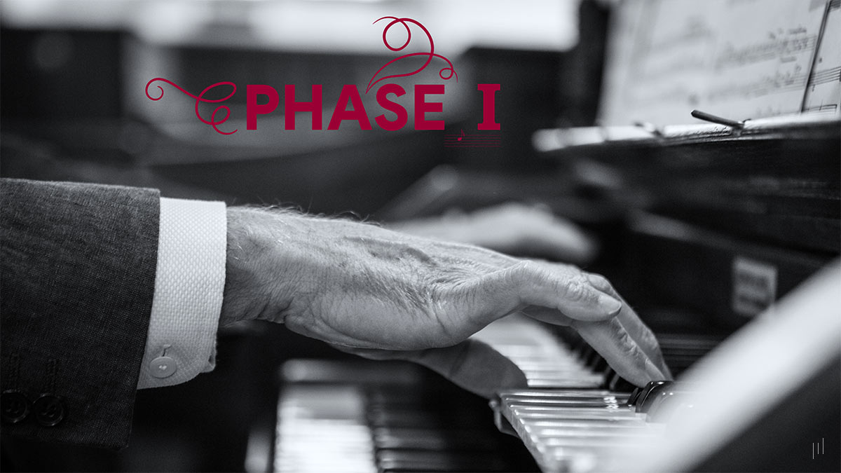 The Cognitive and Wellbeing Benefits Using Creative Improvisation – Section title slide introducing Phase I of the research, featuring a background image of a man’s hands playing piano.