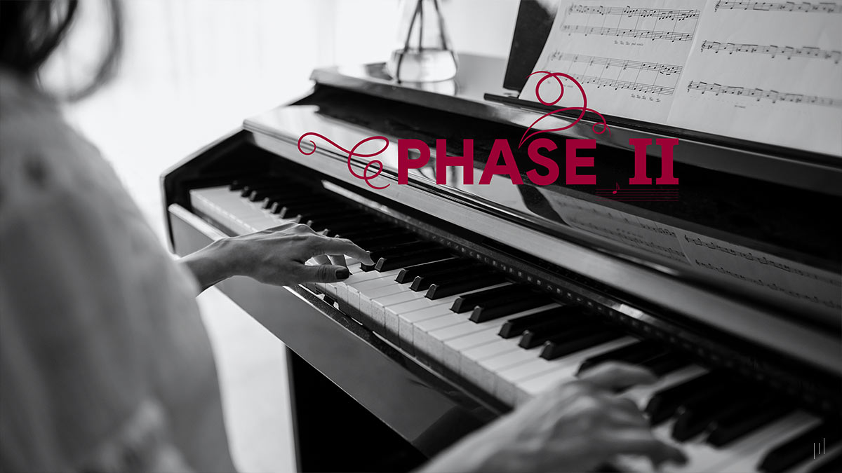 The Cognitive and Wellbeing Benefits Using Creative Improvisation – Section title slide introducing Phase II of the research, featuring a background image of a woman’s hands playing an electro piano.